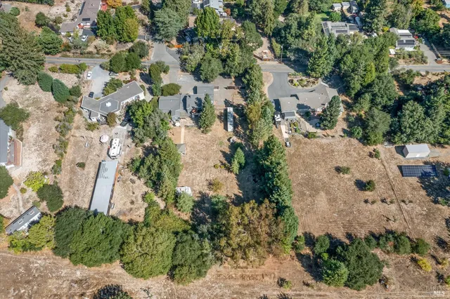 an aerial view of residential house with outdoor space