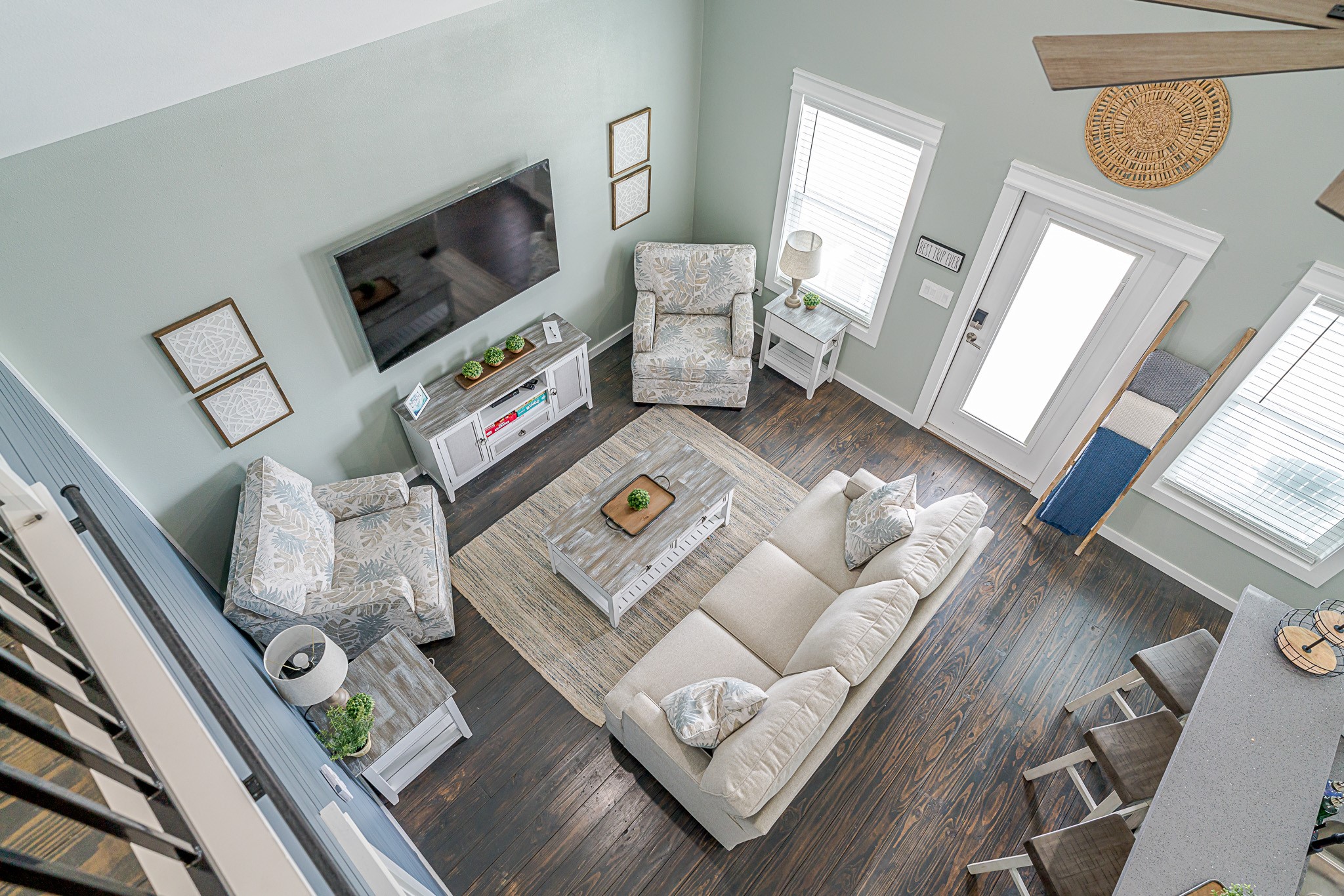 1057 Johnson Road Port Bolivar, TX 77650 - Photo 23 of 40 Looking down from your loft, the open living area feels bright and spacious, with vaulted ceilings and plenty of room to gather after a day at the coast.