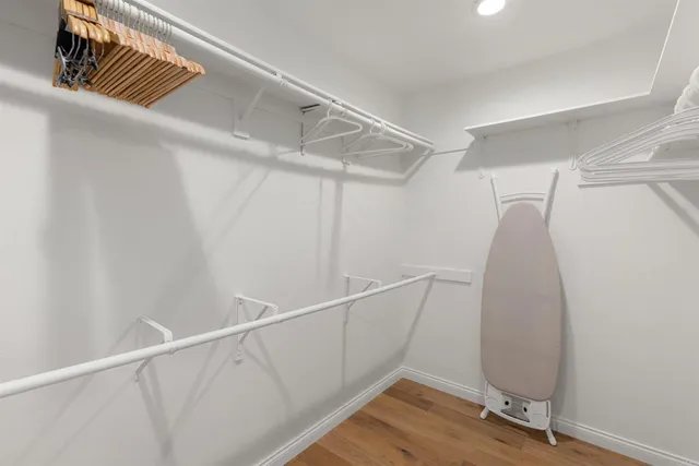 a view of a room with wooden floor