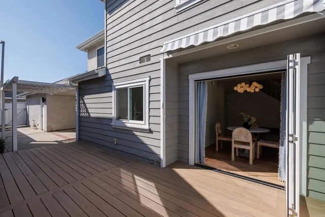 a view of a house with a door and wooden floor