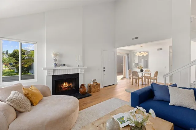 a living room with furniture fireplace and window