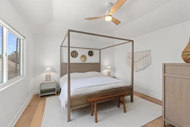 a bedroom with a bed and a table