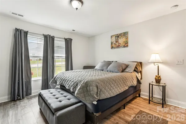 a bed room with a bed and a night stand