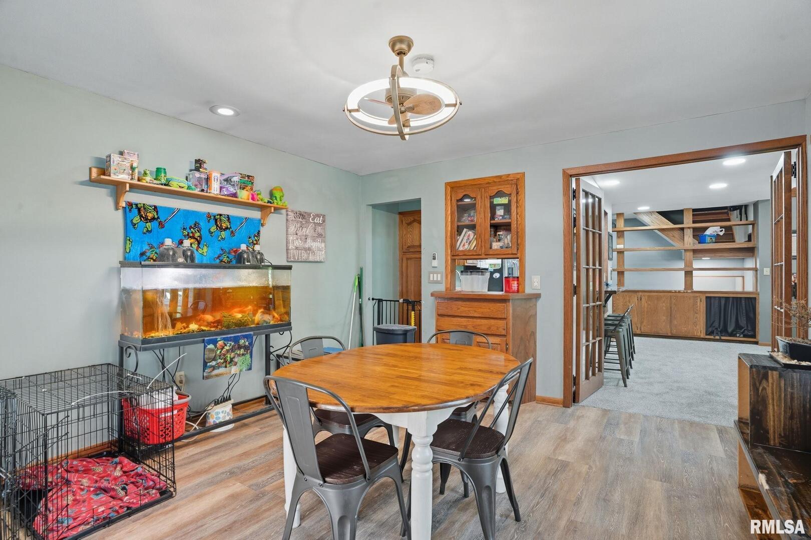 8039 Hazel Road Morrison, IL 61270 - Photo 13 of 39 a dining room with furniture and wooden floor