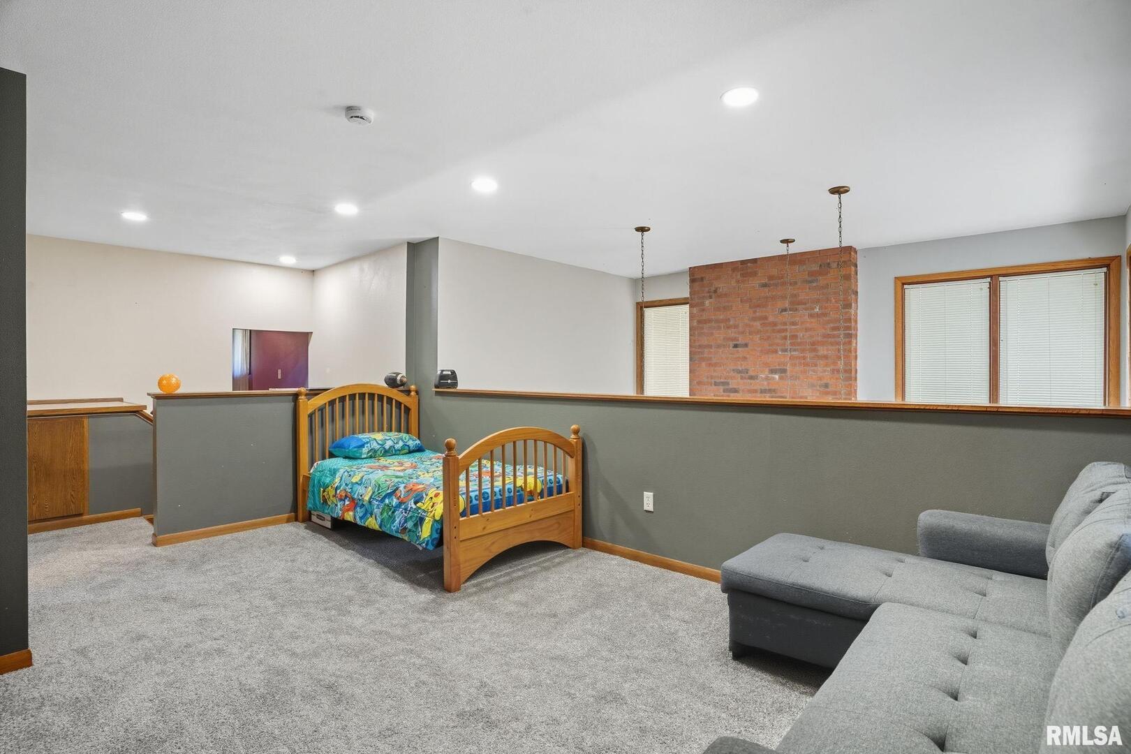 8039 Hazel Road Morrison, IL 61270 - Photo 14 of 39 a bedroom with furniture and a couch