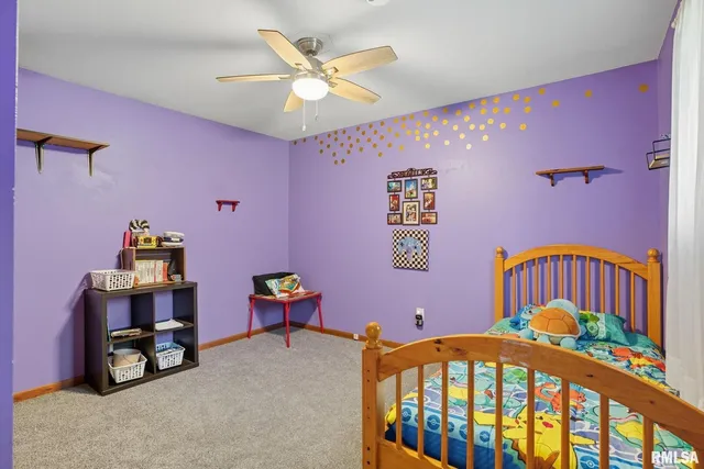 a view of a bedroom with furniture and toys