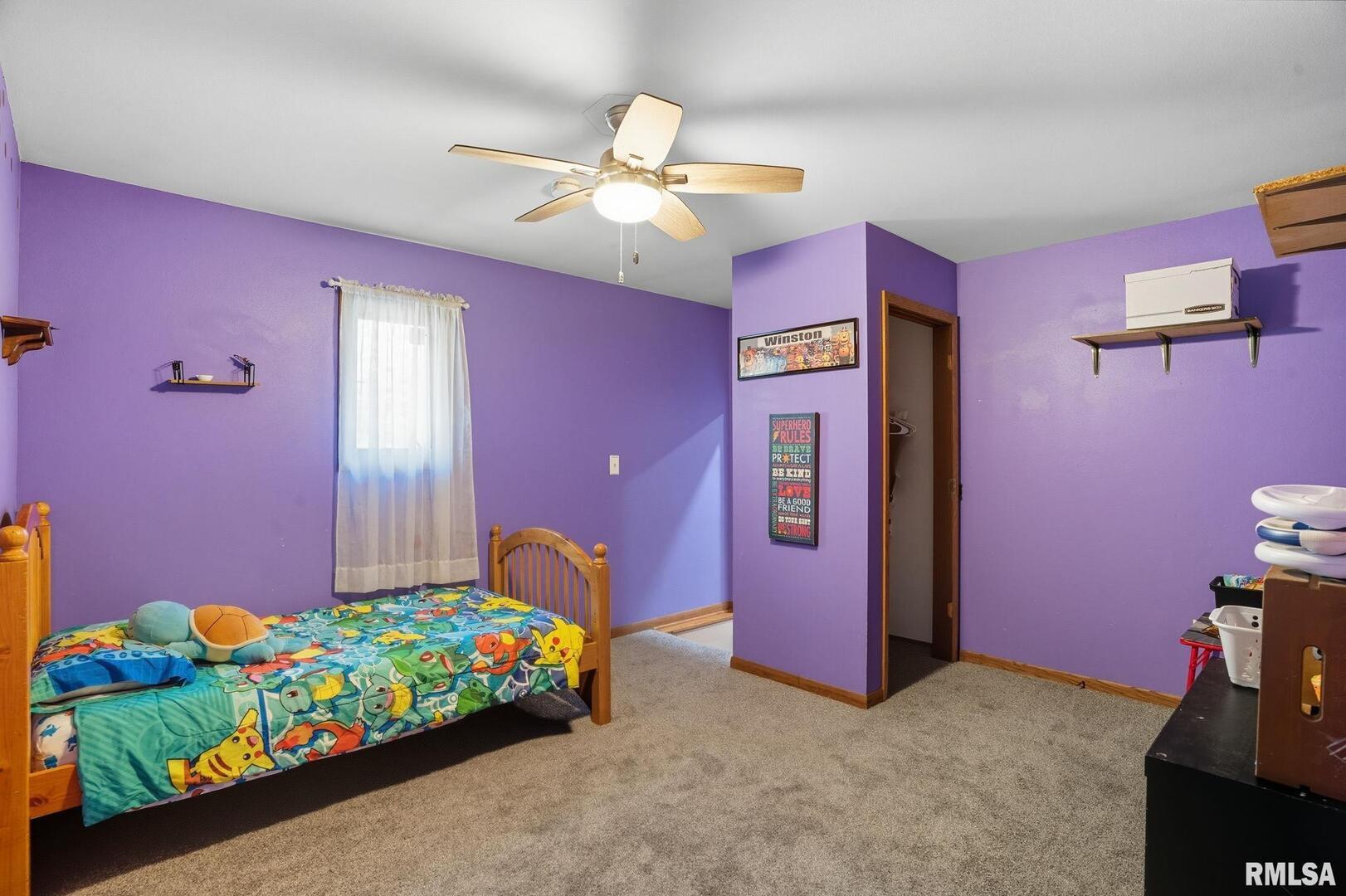 8039 Hazel Road Morrison, IL 61270 - Photo 19 of 39 a bedroom with pink walls and bed