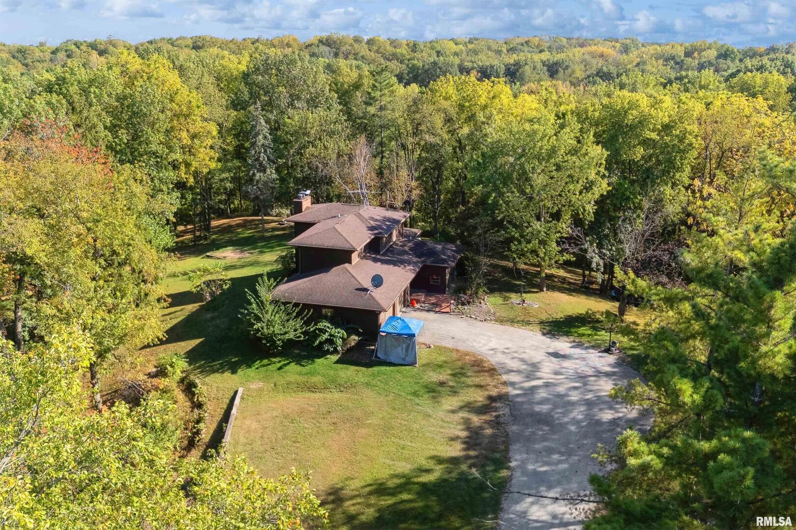 8039 Hazel Road Morrison, IL 61270 - Photo 3 of 39 a view of a small yard with wooden fence