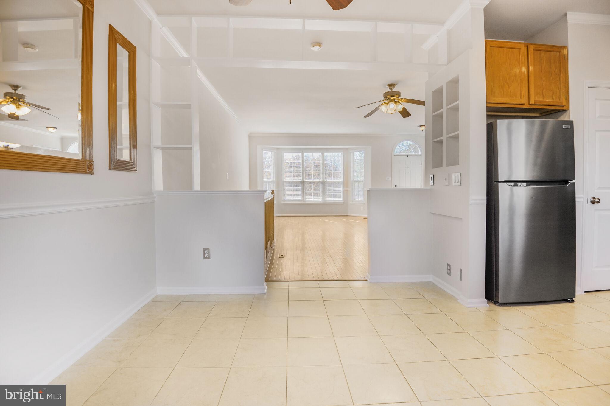 14812 Edman Circle Centreville, VA 20121 - Photo 10 of 24 a view of a kitchen with a refrigerator cabinets and a refrigerator