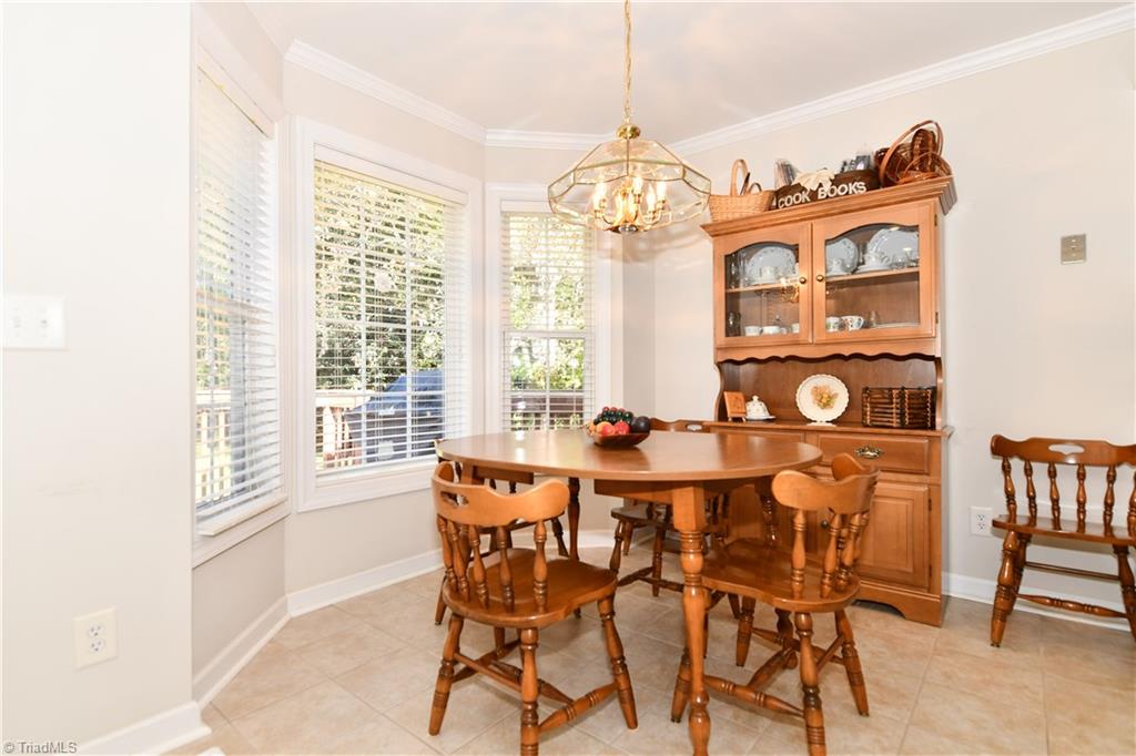 1503 Talbot Road Pleasant Garden, NC 27313 - Photo 14 of 31 Enjoy dining with a gorgeous view of the rear yard and deck & often nature from the bay window.