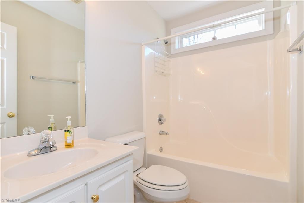 1503 Talbot Road Pleasant Garden, NC 27313 - Photo 22 of 31 2nd full bath serving the two bedrooms on the other side of the home from the master bedroom.
