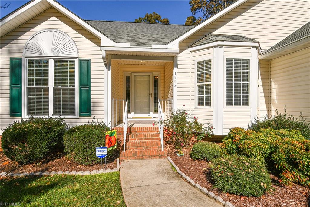 1503 Talbot Road Pleasant Garden, NC 27313 - Photo 4 of 31 An inviting covered front porch welcomes you to this bright and cheery home. Entering from the garage there is only 2 steps not 4.