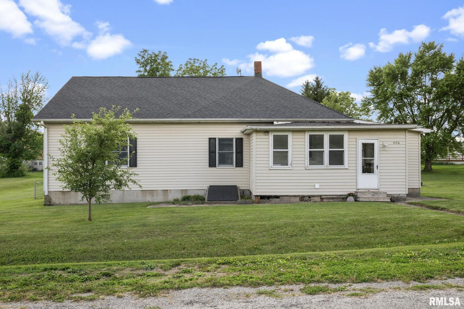406 234th Street Aledo, IL 61231 - Photo 27 of 30 a front view of house with yard and trees