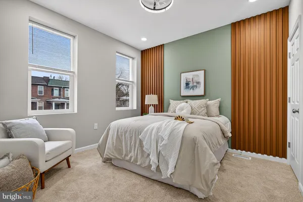 a spacious bedroom with a bed and window