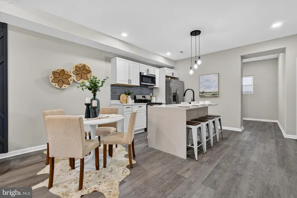 a view of kitchen with furniture and wooden floor