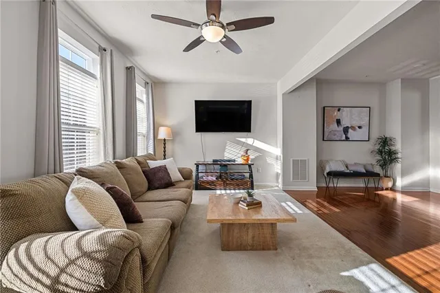 a living room with furniture or couch and a flat screen tv