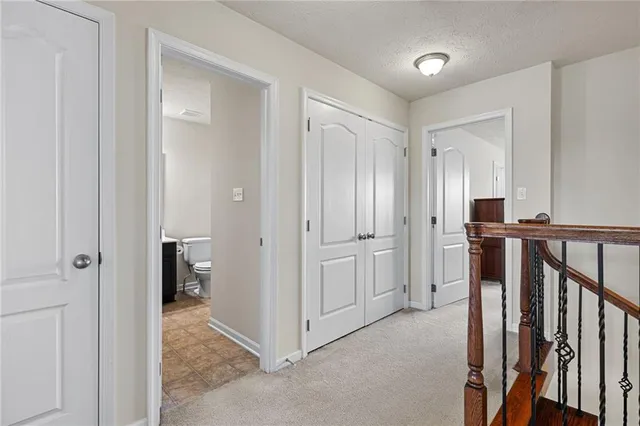 a view of a hallway with closet and entryway