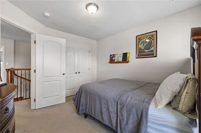 a bedroom with a bed and a cabinets