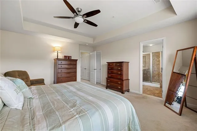 a bedroom with a bed and a flat tv screen