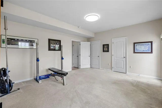 a view of a livingroom with gym equipment
