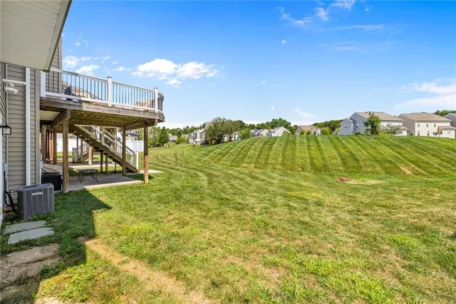 a view of a swimming pool with an outdoor space and seating area