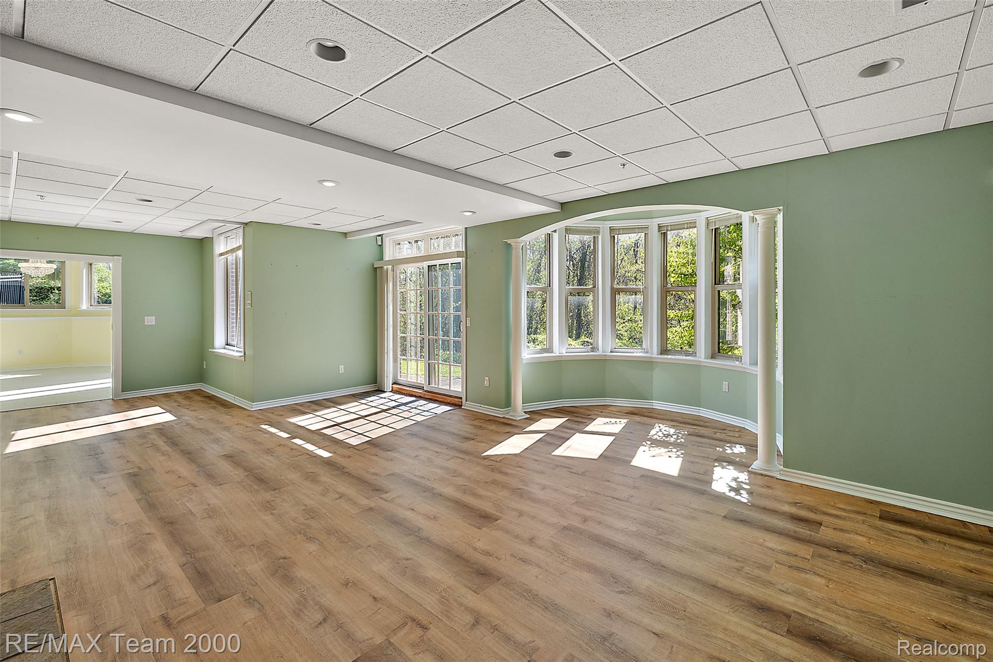 630 Sheldon Court Rochester, MI 48306 - Photo 75 of 94 Empty room with a paneled ceiling and wood finished floors
