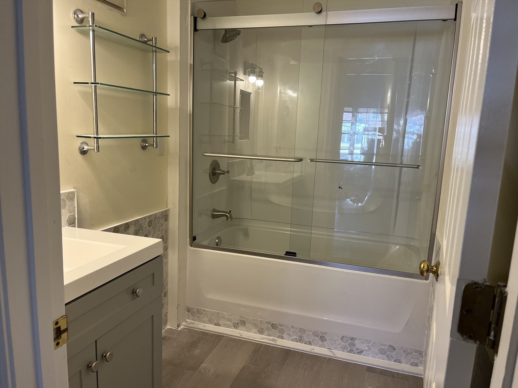 324 Washington Street, Unit 103 Wellesley, MA 02481 - Photo 5 of 13 a bathroom with a shower