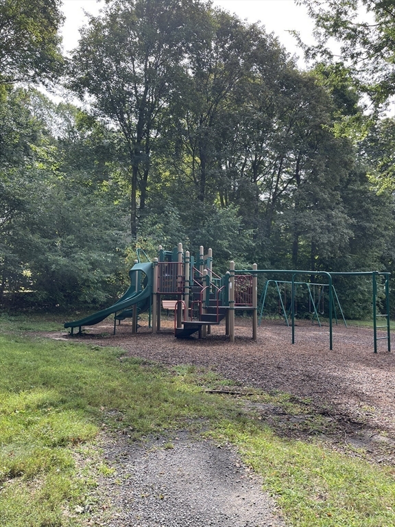 324 Washington Street, Unit 103 Wellesley, MA 02481 - Photo 8 of 13 a view of a park with swings and slides