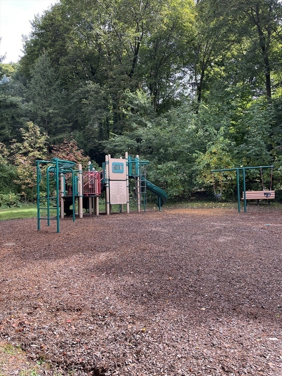 324 Washington Street, Unit 103 Wellesley, MA 02481 - Photo 9 of 13 a view of a backyard with large trees