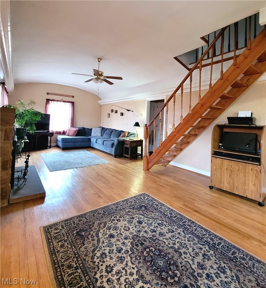 4520 4th Street Northwest Canton, OH 44708 - Photo 12 of 29 Living room with light hardwood / wood-style flooring, vaulted ceiling, and ceiling fan