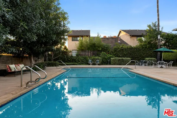 a view of a swimming pool with a patio