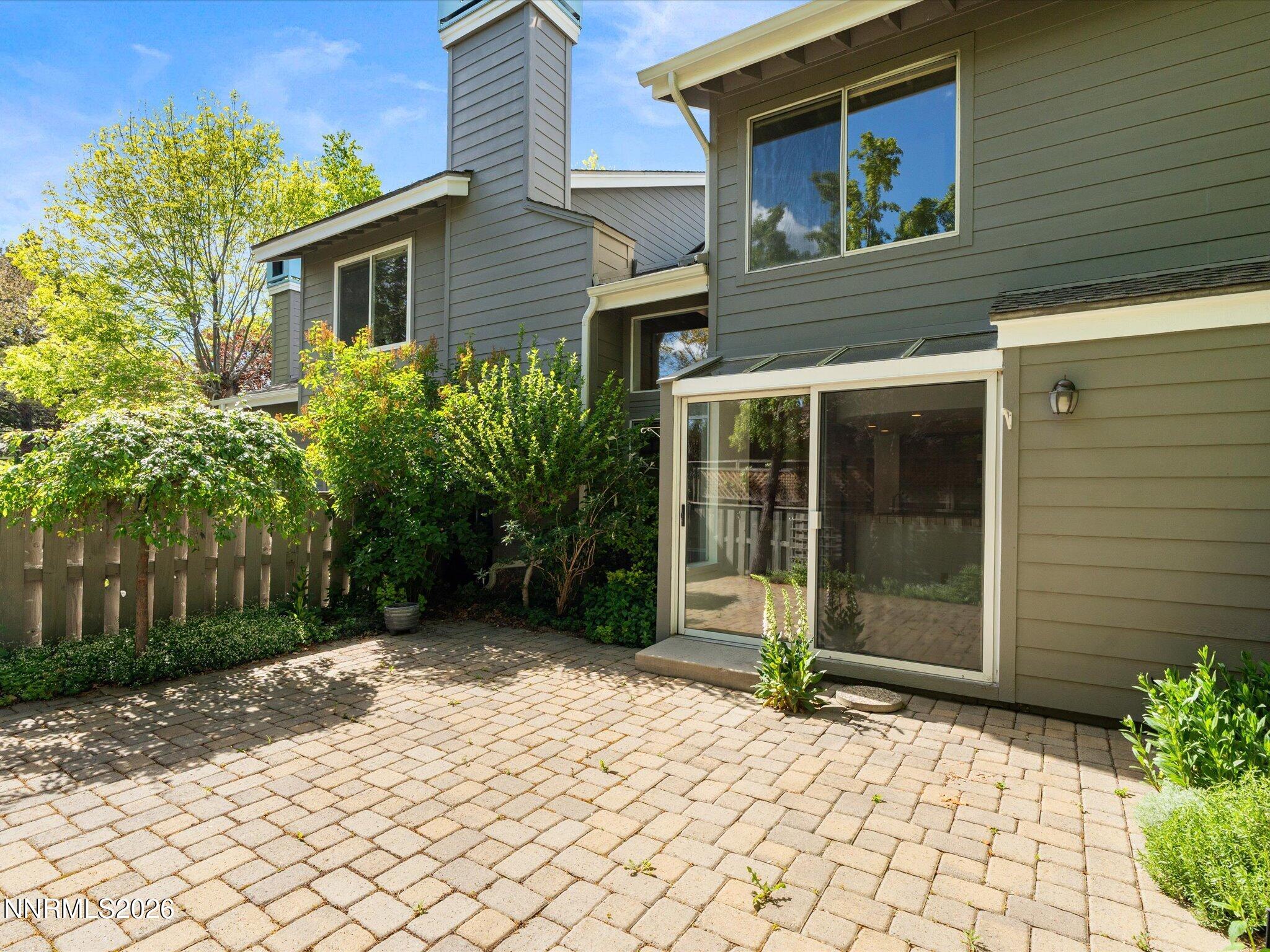3170 Oakshire Court Reno, NV 89509 - Photo 36 of 43 a backyard of a house with potted plants and trees