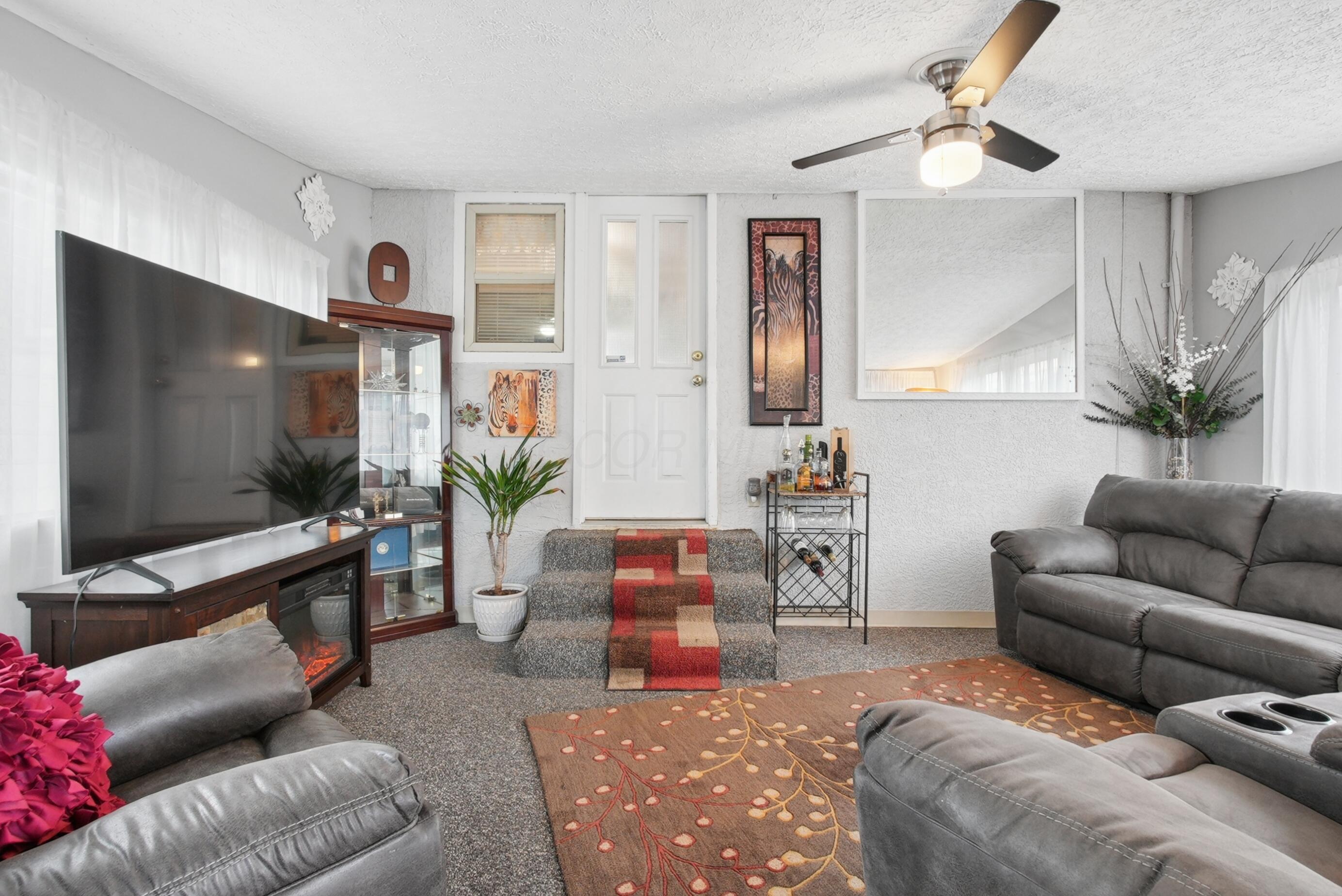1636 Courtright Road Columbus, OH 43227 - Photo 14 of 35 Carpeted flooring, white walls, and a ceiling fan with integrated lighting. Game Day Anyone?