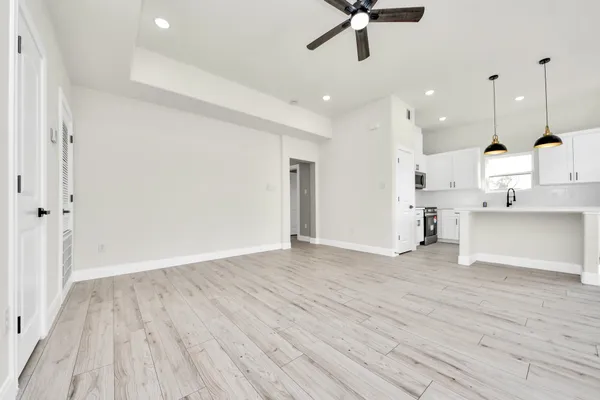 a view of kitchen with wooden floor and window
