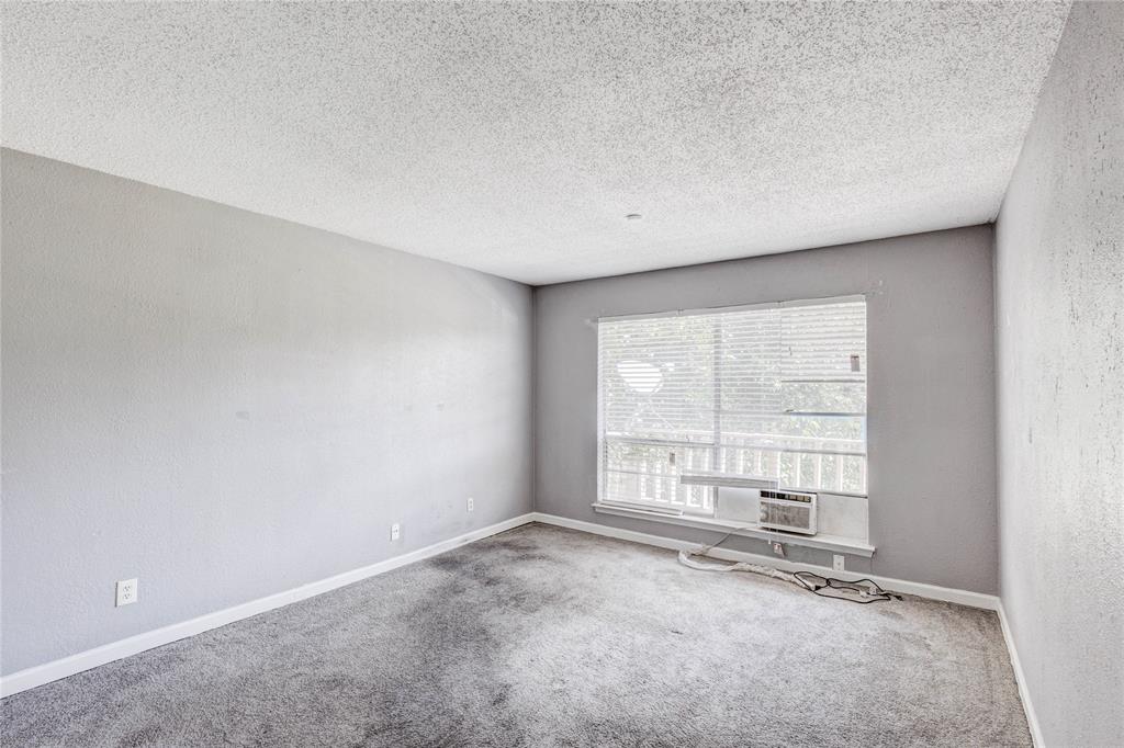 5063 Ridglea Lane, Unit 1002 Fort Worth, TX 76116 - Photo 11 of 11 an empty room with windows