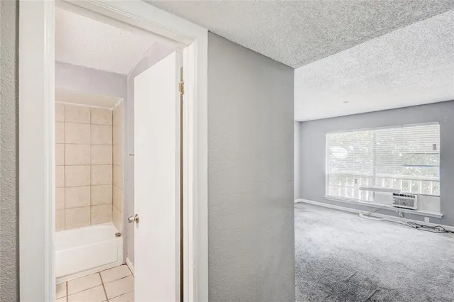 a view of an empty room with a window