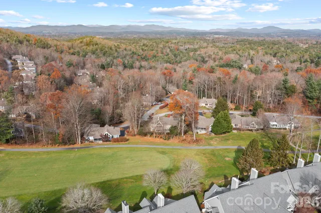 a view of residential houses with outdoor space