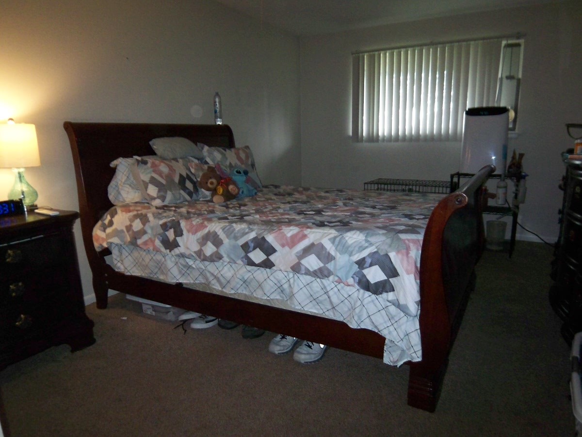 1500 Busse Road, Unit 2D Mount Prospect, IL 60056 - Photo 11 of 18 a bed sitting in a bedroom next to a window