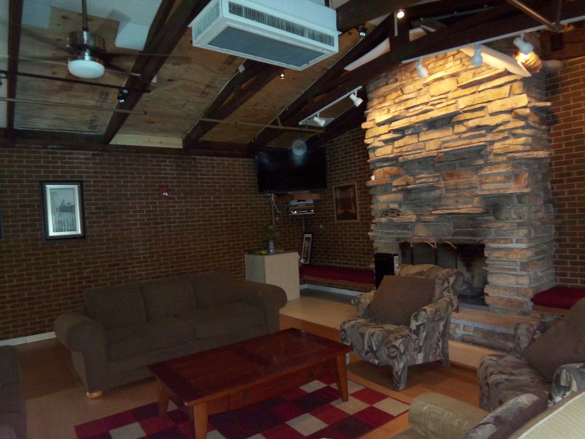 1500 Busse Road, Unit 2D Mount Prospect, IL 60056 - Photo 17 of 18 a outdoor living space with patio furniture and a fireplace