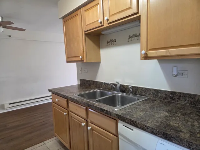 a kitchen with a sink and cabinets