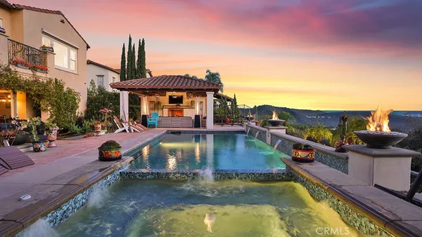 a view of a swimming pool with a patio