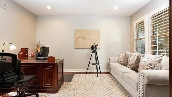 a bedroom with a bed and ceiling fan