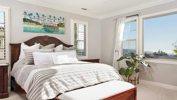 a bathroom with a double vanity sink toilet and a mirror