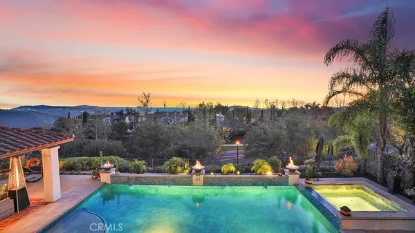 a utility room with wooden floor washer and dryer
