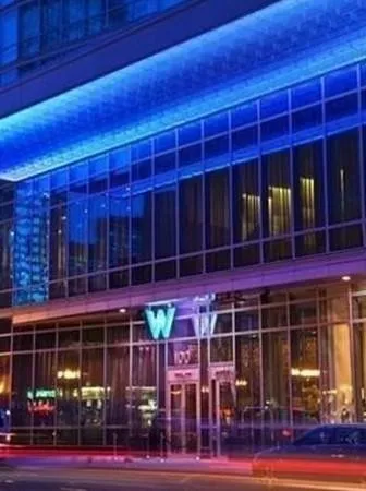 a front view of a building with glass windows and a lot of windows