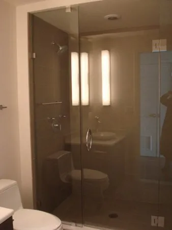 a bathroom with a toilet and a shower