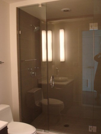 110 Stuart Street, Unit 24I Boston, MA 02116 - Photo 13 of 24 a bathroom with a toilet and a shower