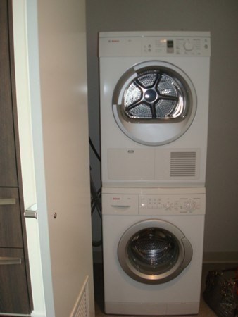 110 Stuart Street, Unit 24I Boston, MA 02116 - Photo 15 of 24 a close up view of washer and dryer