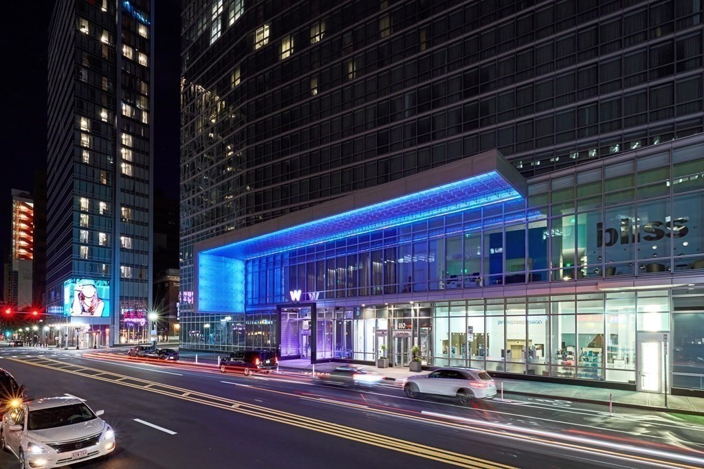 110 Stuart Street, Unit 24I Boston, MA 02116 - Photo 23 of 24 a view of a building and a cars park in front of the building