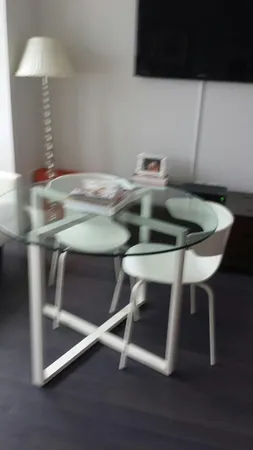 a kitchen with a table chairs and a stove